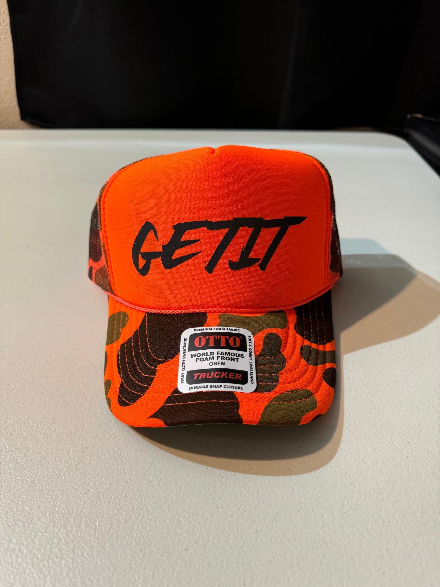 CAMO Orange Reflective Logo Trucker Hat