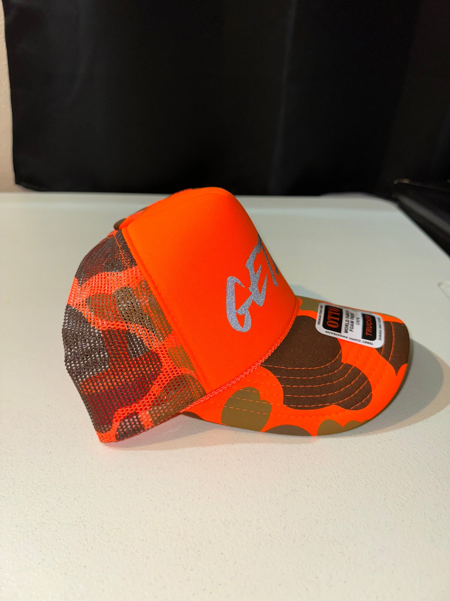 CAMO Orange Reflective Logo Trucker Hat